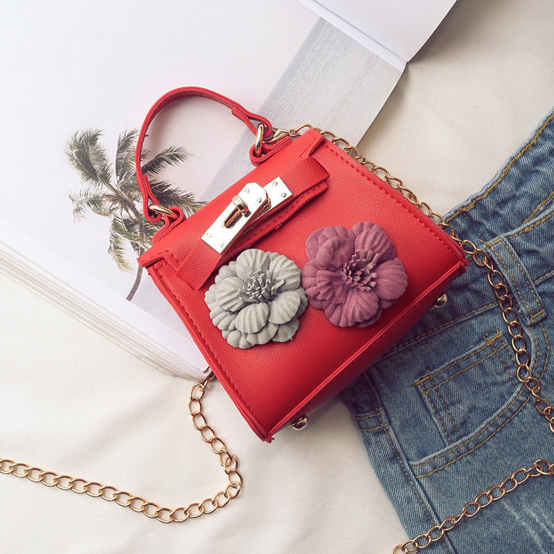 Neue weibliche Kinder Tasche Mini Kylie Tasche Handtasche Mode Flut Blume Tasche Schulter Messenger Tasche.